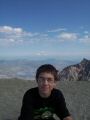 Hunter on the crater summit (Mount Rainier in the distance).jpg